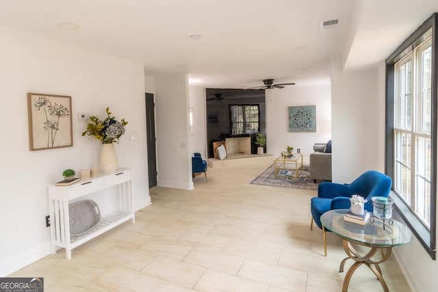 sitting room with ceiling fan