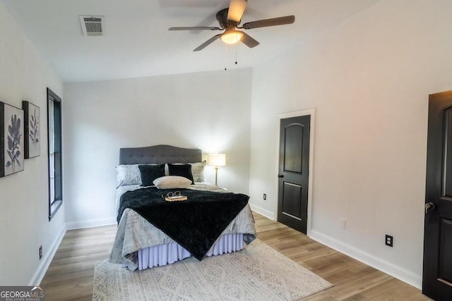 bedroom with wood-type flooring and ceiling fan