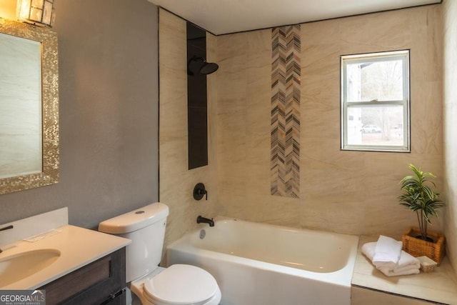 full bathroom featuring vanity, toilet, and tiled shower / bath combo