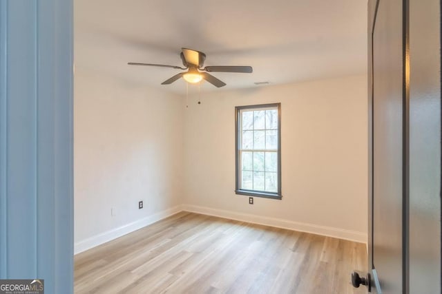 spare room featuring ceiling fan and light hardwood / wood-style floors