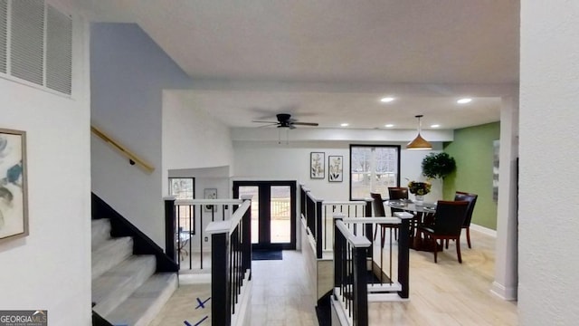 interior space with hardwood / wood-style floors and ceiling fan