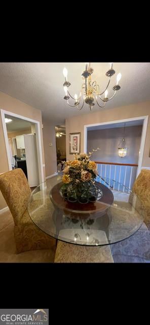 dining area featuring a notable chandelier