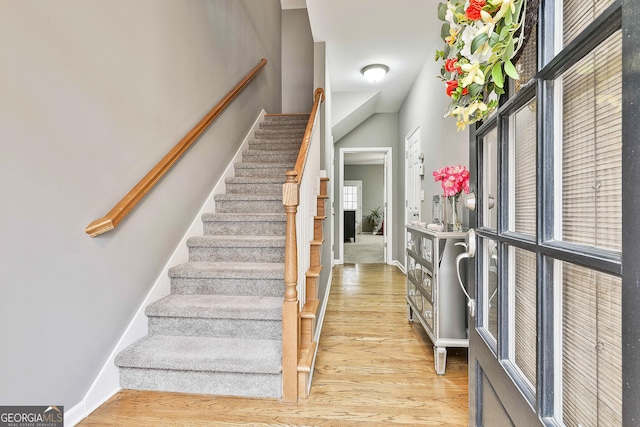 staircase featuring hardwood / wood-style flooring