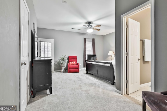 bedroom featuring ceiling fan and light colored carpet