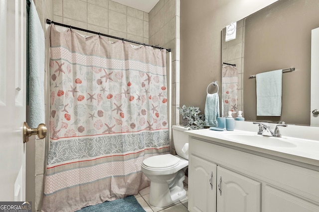 bathroom with vanity, toilet, and tile patterned flooring