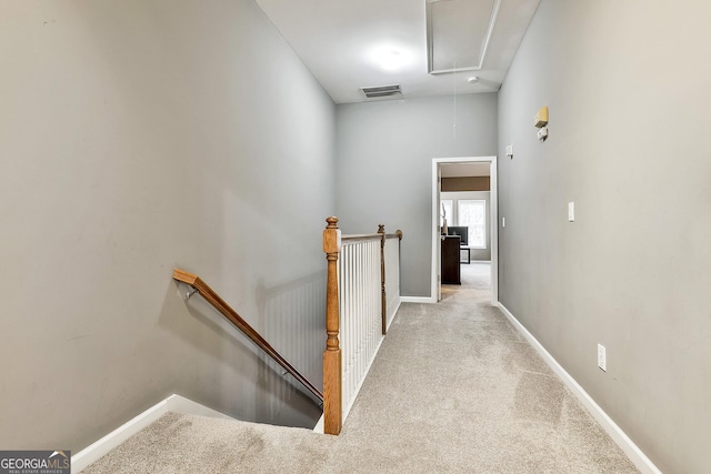 corridor with light carpet