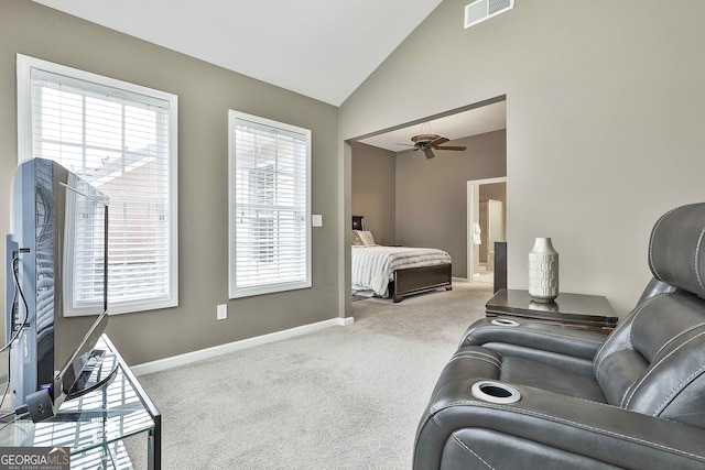 bedroom featuring light colored carpet and lofted ceiling