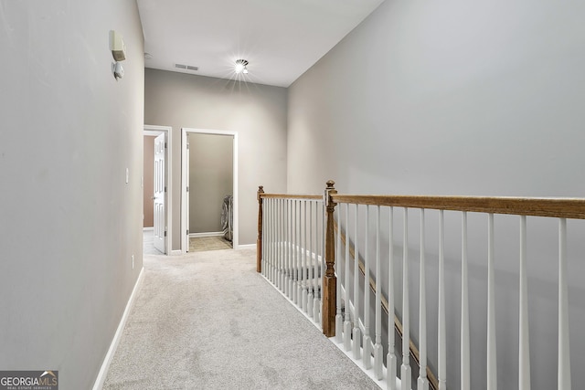 hallway with light carpet