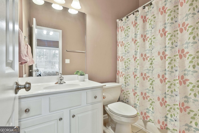 bathroom featuring vanity, toilet, and a shower with shower curtain