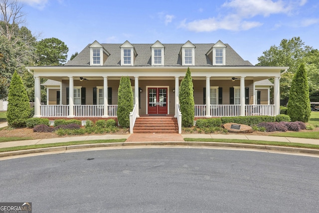 view of front of house featuring ceiling fan, french doors, and a porch