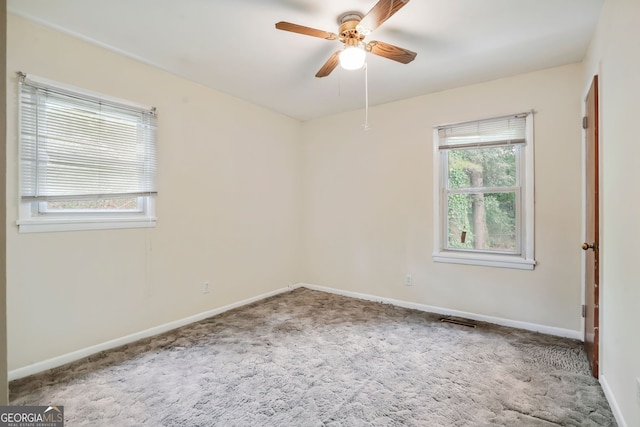 unfurnished room featuring carpet floors and ceiling fan