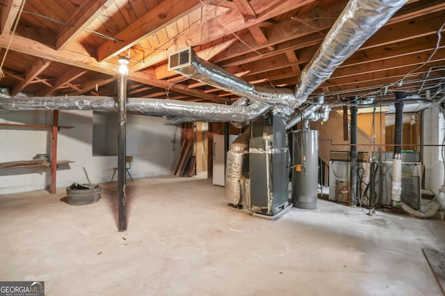 basement featuring heating unit and water heater