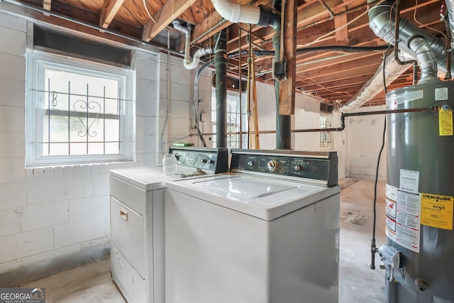 washroom featuring gas water heater and washing machine and clothes dryer