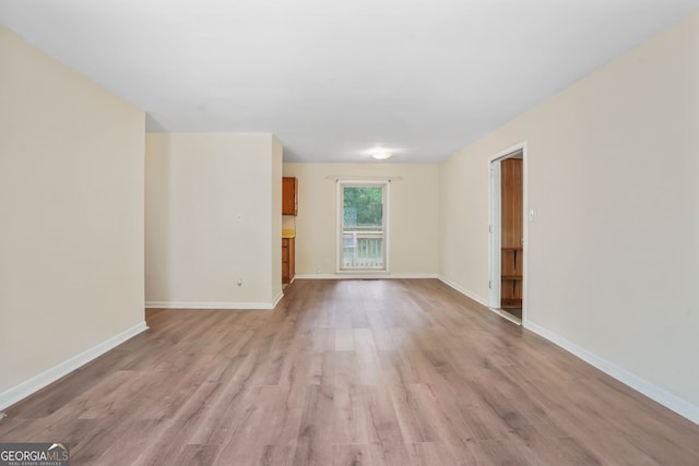 unfurnished living room featuring light wood-type flooring