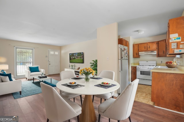 dining space featuring hardwood / wood-style flooring