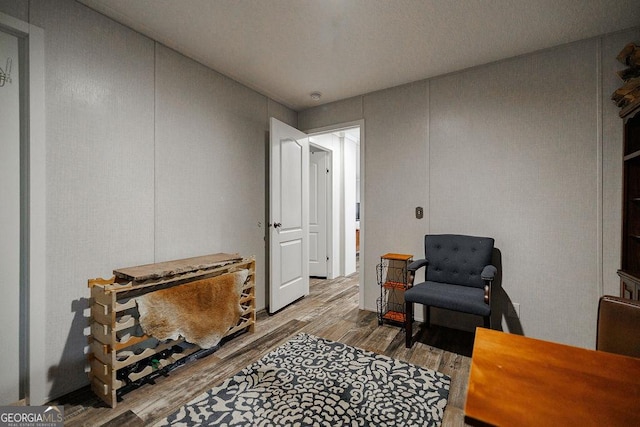 sitting room with hardwood / wood-style floors