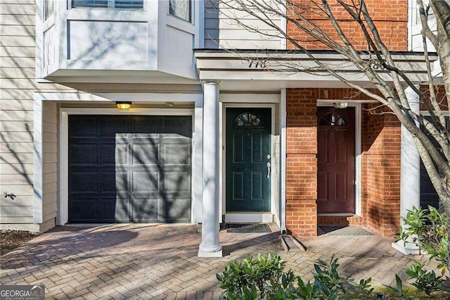 property entrance with a garage