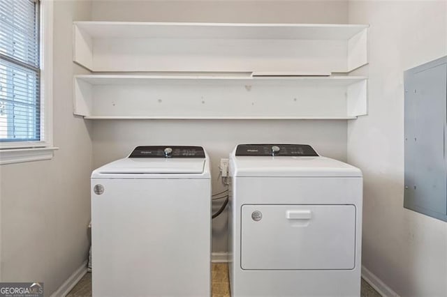 clothes washing area with separate washer and dryer