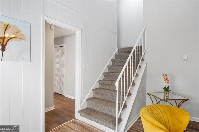 staircase featuring hardwood / wood-style flooring