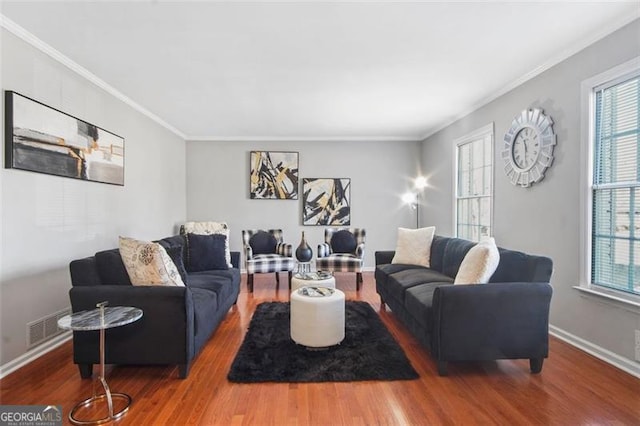 living room with hardwood / wood-style flooring and ornamental molding