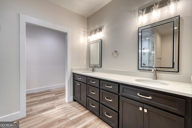 bathroom with wood-type flooring and vanity