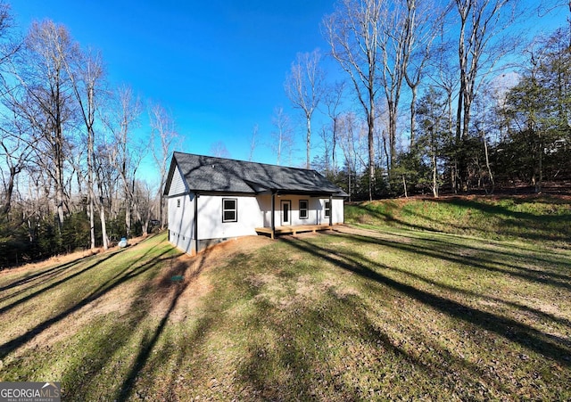 view of property exterior with a yard