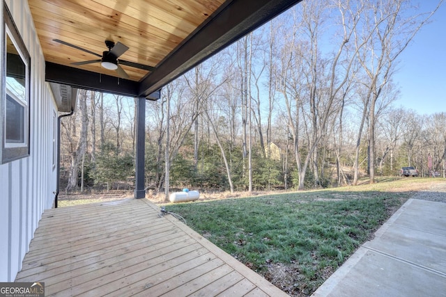 deck featuring a lawn and ceiling fan