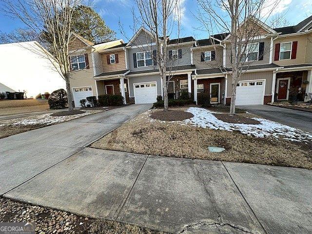 multi unit property featuring a garage