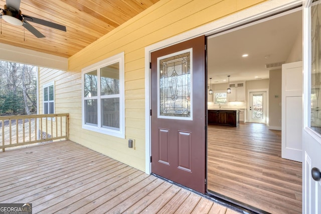 exterior space with ceiling fan