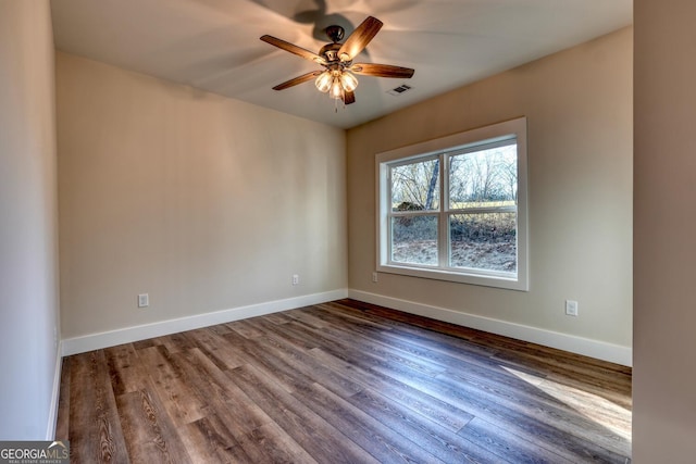 empty room featuring ceiling fan and hardwood / wood-style floors