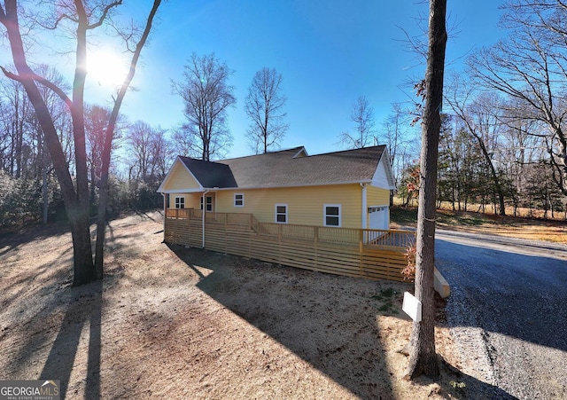 view of property exterior with a garage