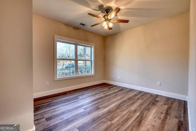 spare room with wood-type flooring and ceiling fan