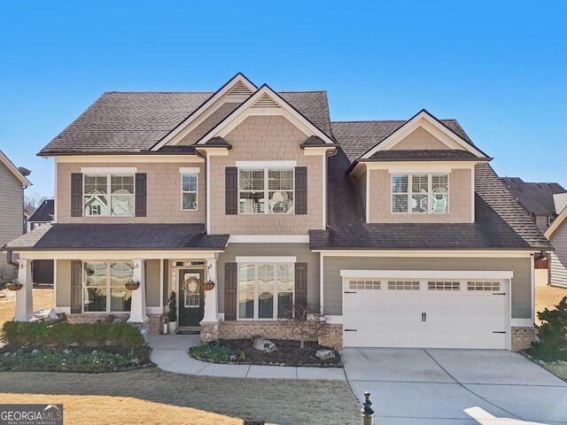 craftsman-style house with a front yard and a garage