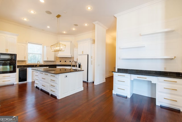 kitchen with decorative light fixtures, black appliances, white cabinetry, and a kitchen island