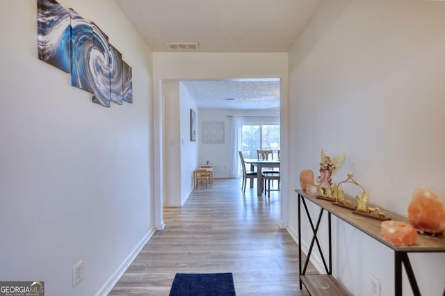 hall featuring light hardwood / wood-style floors