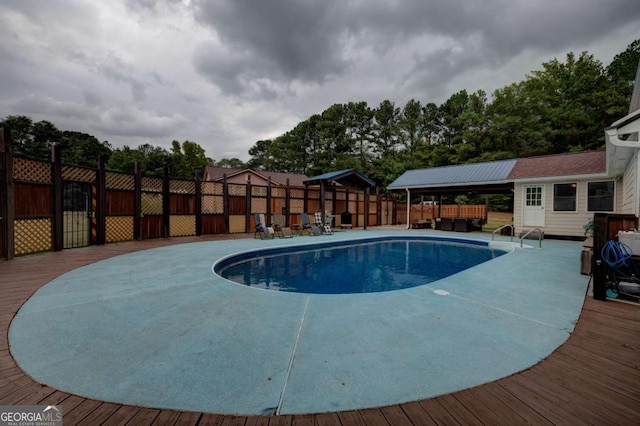 view of pool featuring a wooden deck