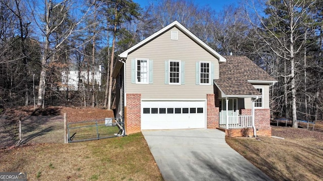 view of front of house with a garage and a front yard