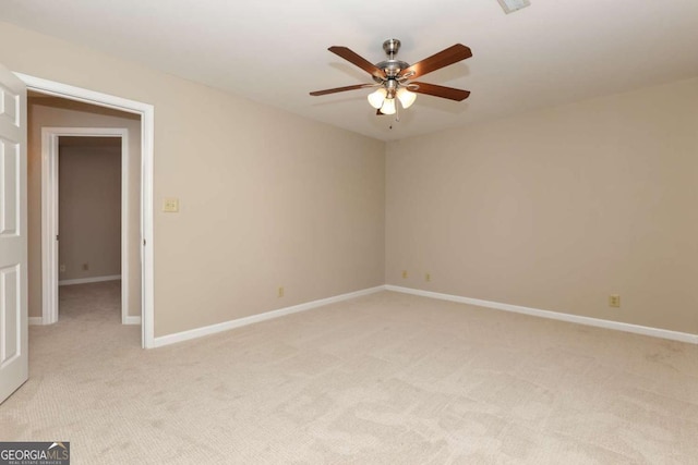 empty room with light carpet and ceiling fan