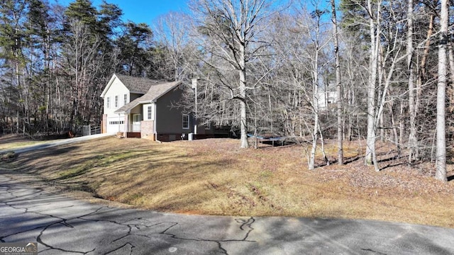 view of property exterior with a garage