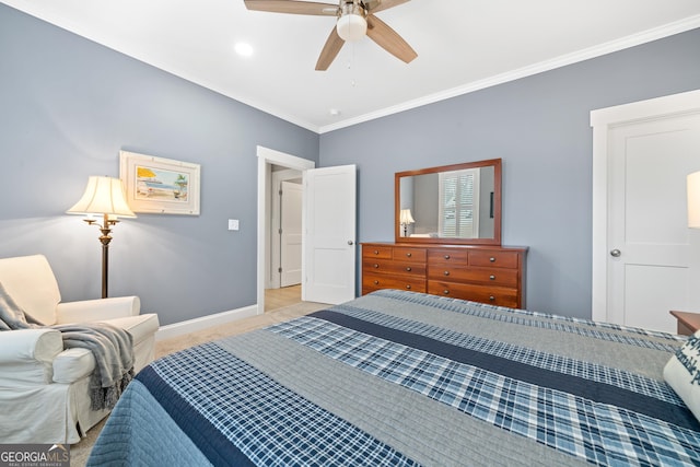 carpeted bedroom featuring ceiling fan and crown molding