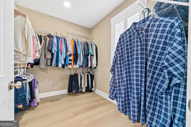 spacious closet with hardwood / wood-style floors