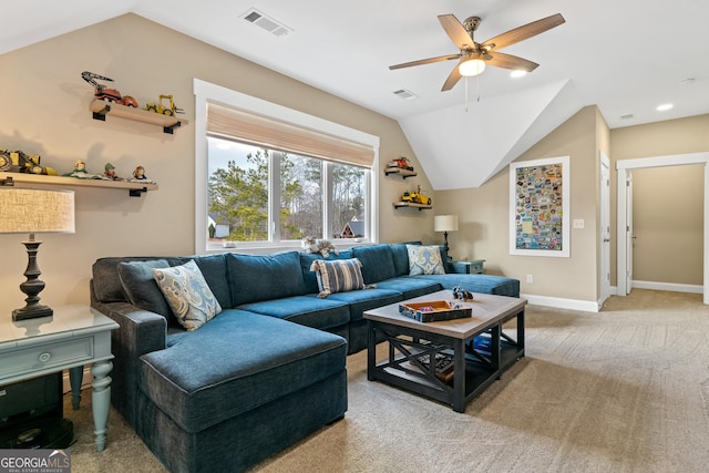 living room featuring vaulted ceiling, ceiling fan, and light colored carpet