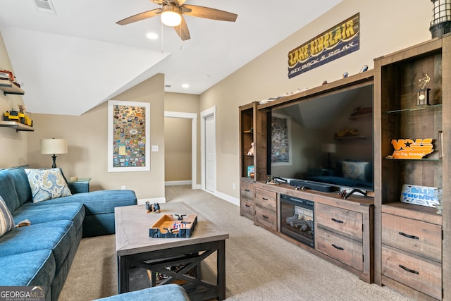 living room with ceiling fan and carpet floors