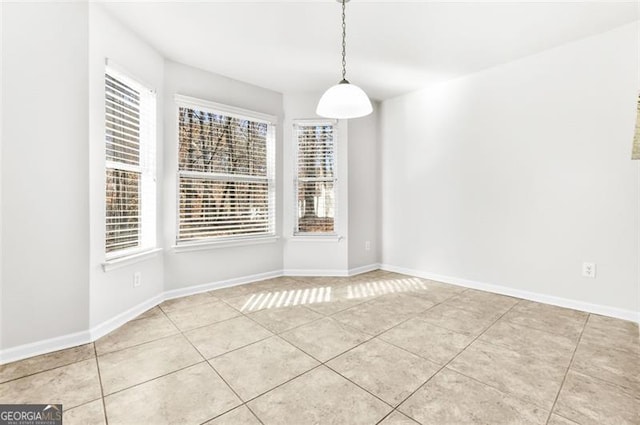 unfurnished dining area with a healthy amount of sunlight and light tile patterned floors