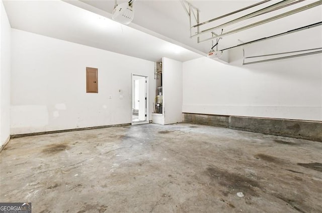 garage featuring electric panel and a garage door opener