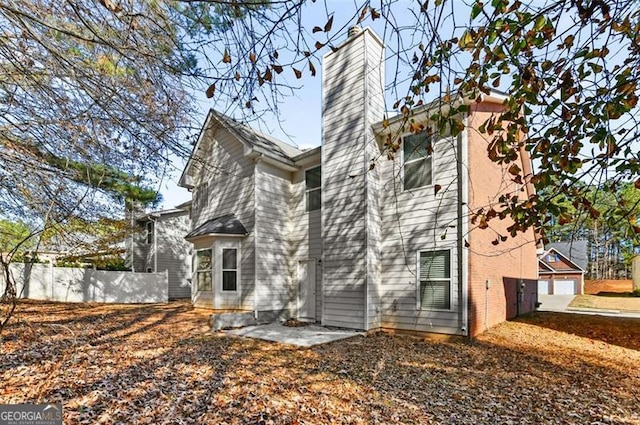 back of house with a patio