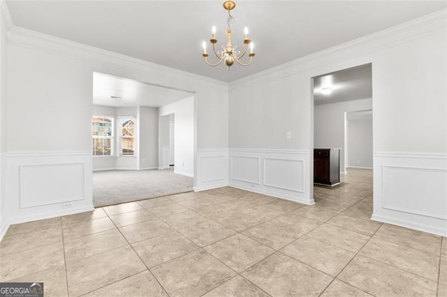 unfurnished dining area featuring ornamental molding, light tile patterned floors, and an inviting chandelier