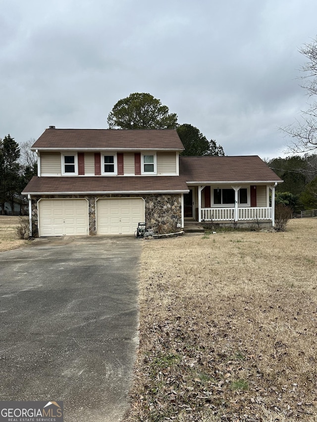 view of front of house featuring a garage and covered porch