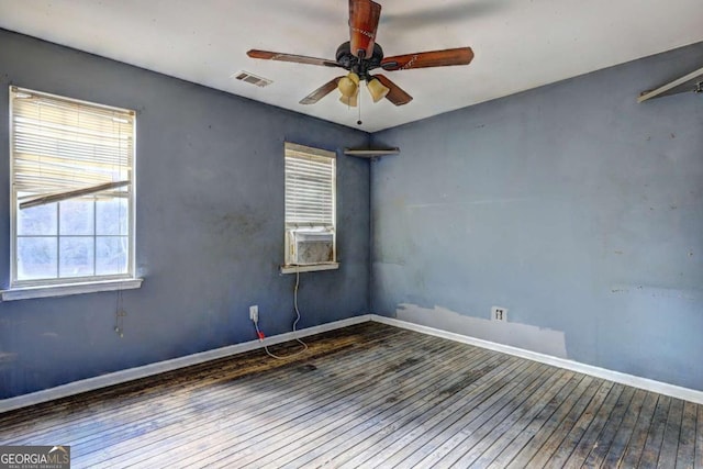 unfurnished room featuring ceiling fan, cooling unit, and wood-type flooring