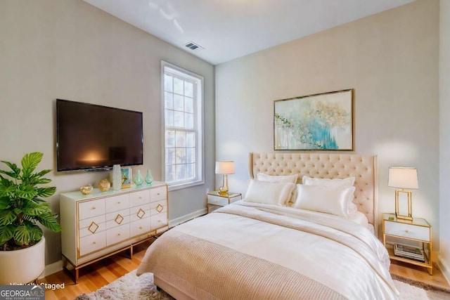 bedroom with light hardwood / wood-style floors